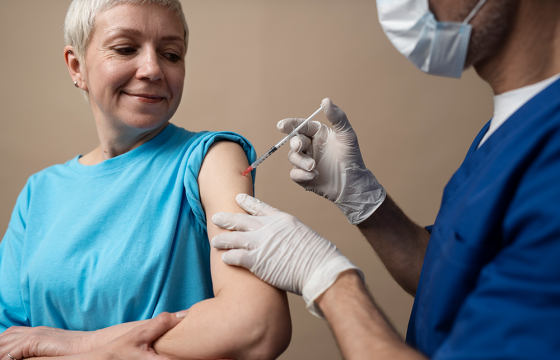 smiley-woman-getting-vaccine-small
